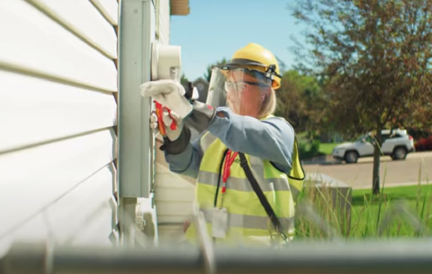 A contractor with NorthWestern Energy changes out a meter.